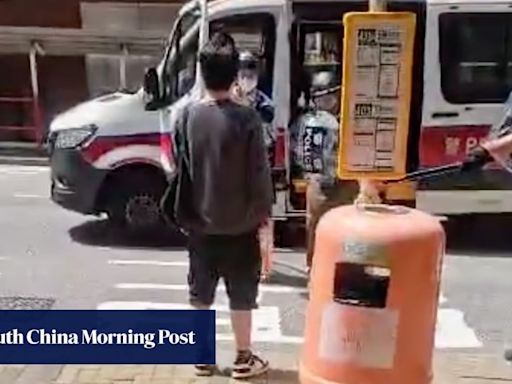 Hong Kong police officer draws gun to arrest man who was yelling, holding knife