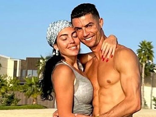 Cristiano Ronaldo poses in shirtless holiday snap alongside bikini-clad model girlfriend Georgina