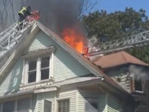 Mayday ordered after firefighter gets trapped on roof of burning building in Boston