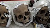 17 human skulls found buried in metal boxes at suspected shrine in Uganda