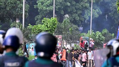 Bangladesh protesters set fire to state TV headquarters, many people are trapped inside; toll rises to 32