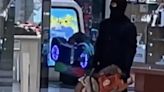 Shock moment masked robber brandishes circular saw in shopping centre