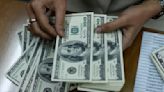 Dollar treads water after tame US inflation report, yen rally stalls