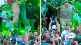 Shirtless Eagles fan 'tears his ACL' while chest bumping Jason Kelce on stage