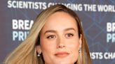 Brie Larson Swaps A Cozy Cardigan Look For A Glam Saint Laurent LBD In New Video: 'From Day To Night'