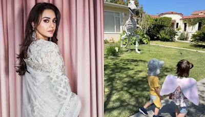 Preity Zinta's twins are amused with a Dinosaur statue during their morning walk! - Times of India