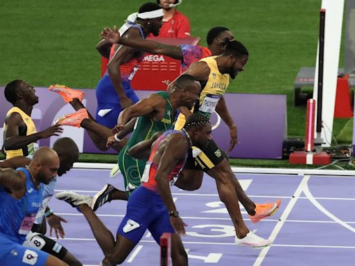 Noah Lyles takes men’s 100m gold by narrowest margin in dramatic Olympic final