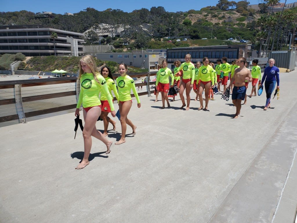 ‘Nervous and really excited’: Junior lifeguards take the plunge from Scripps Pier for the first time