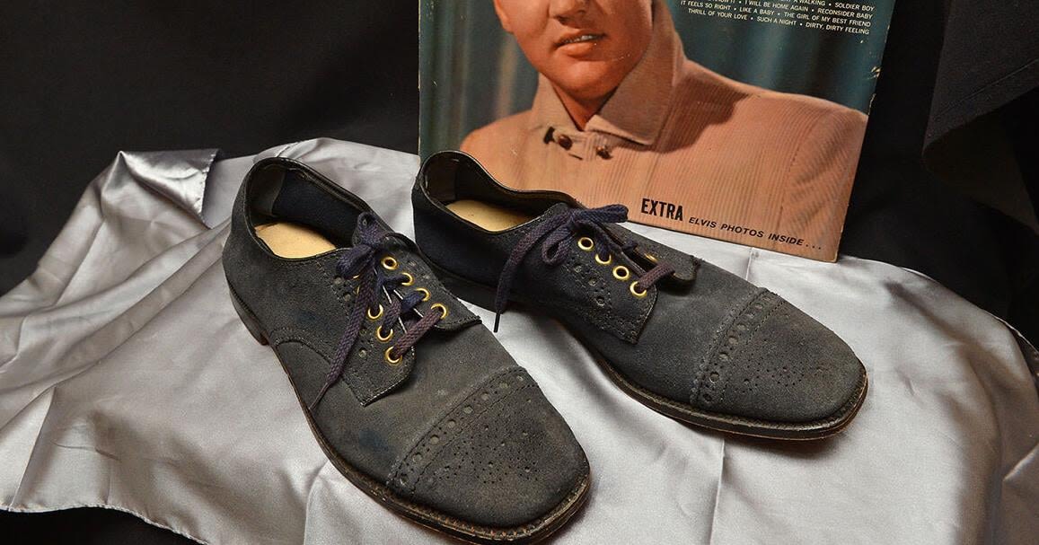 Elvis Presley’s blue suede shoes fetch over $150K at auction