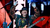 Carlos Santana is 'anxious to be back on stage' but has to reschedule more concerts