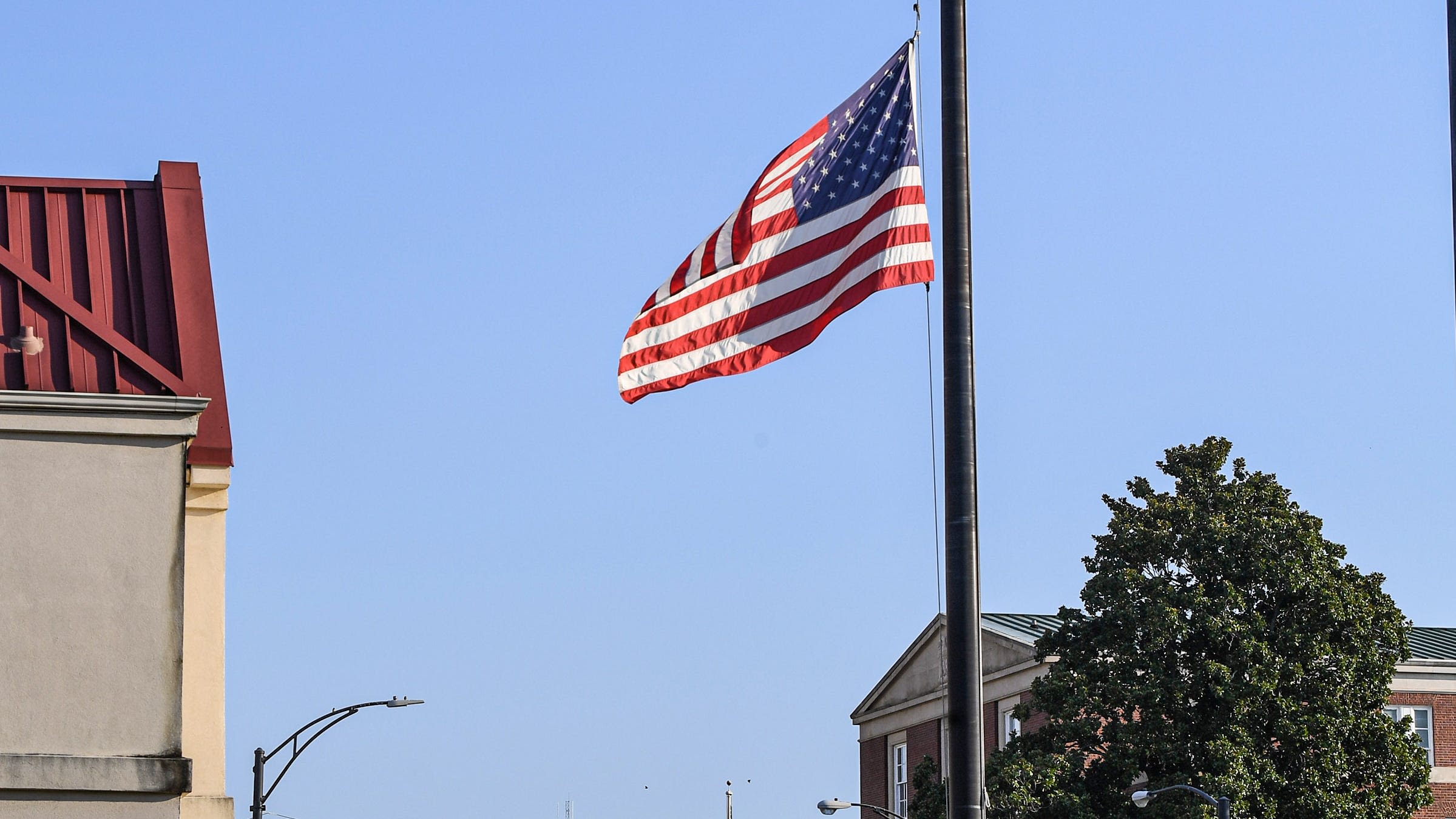 Why are flags flying at half-staff in South Carolina?