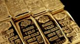 Gold slips from record levels after hot U.S. inflation data