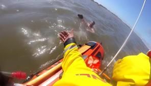 Dramatic lifeboat rescue saves dog walker and pet from incoming tides | FOX 28 Spokane