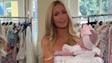 Paris Hilton jokes that her 5-month-old daughter could use a spray tan during their photo shoot