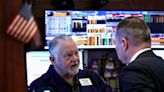 Wall St ends down after PPI data and as chipmakers fall