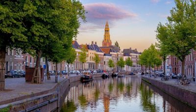 Skip the tourist traps and high prices in Amsterdam — take a short train ride to this beautiful gem instead