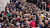 Thousands wait for hours to catch glimpse of Queen’s coffin