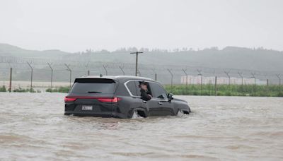 Kim Jong-un surveys massive flooding in North Korea from his Lexus as 5,000 rescued