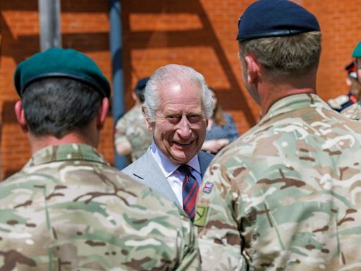 King ‘glad to be out of cage’ in first military visit since cancer diagnosis