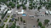 Helicopters scramble to rescue people in flooded Iowa town while much of US toils again in heat