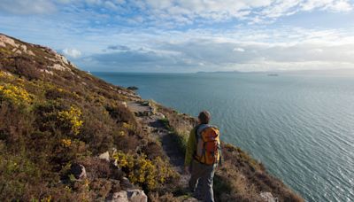 The secret Irish beach with stunning views & tranquil waters by harbour village