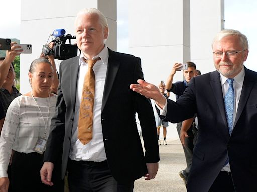 Julian Assange walks free from court after pleading guilty in US deal