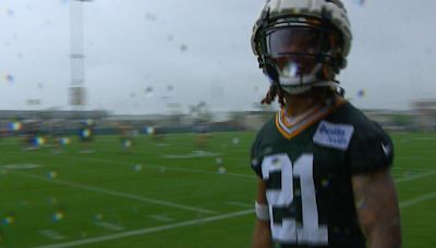 Packers roll with the punches as pouring rain soaks team, spectators at training camp