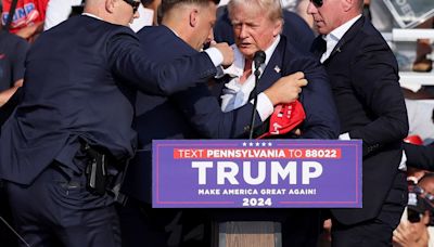 Trump shot in ear in assassination bid, suspect named - as it happened