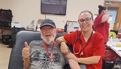 Daughter working with the Red Cross gets to help with her father's donation