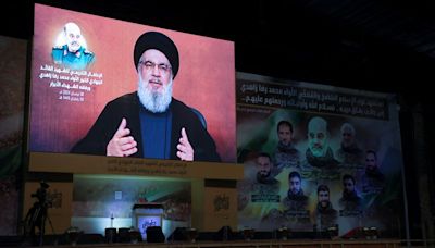 Hezbollah vows 'definite' response to Israeli killing of top commander