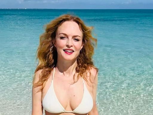 Heather Graham displays phenomenal physique in tiny string bikini in jaw-dropping new photos