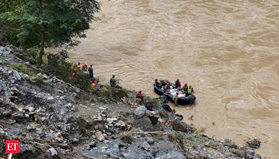Search for dozens missing after landslide sweeps buses into Nepal river is suspended - The Economic Times