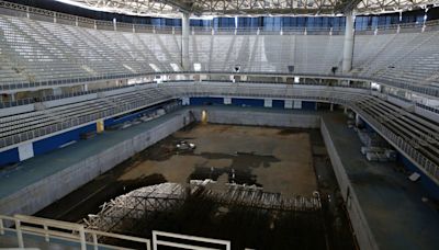Olympic venues let to rot… including decaying village taken over by squatters