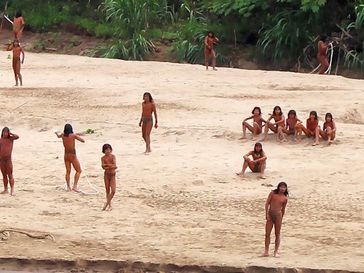 Rare pictures released of uncontacted Amazon rainforest tribe in Peru emerging near logging site