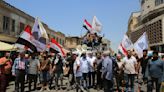 Bank owners and citizens protest deterioration of the Iraqi dinar following US ban on Iraqi banks