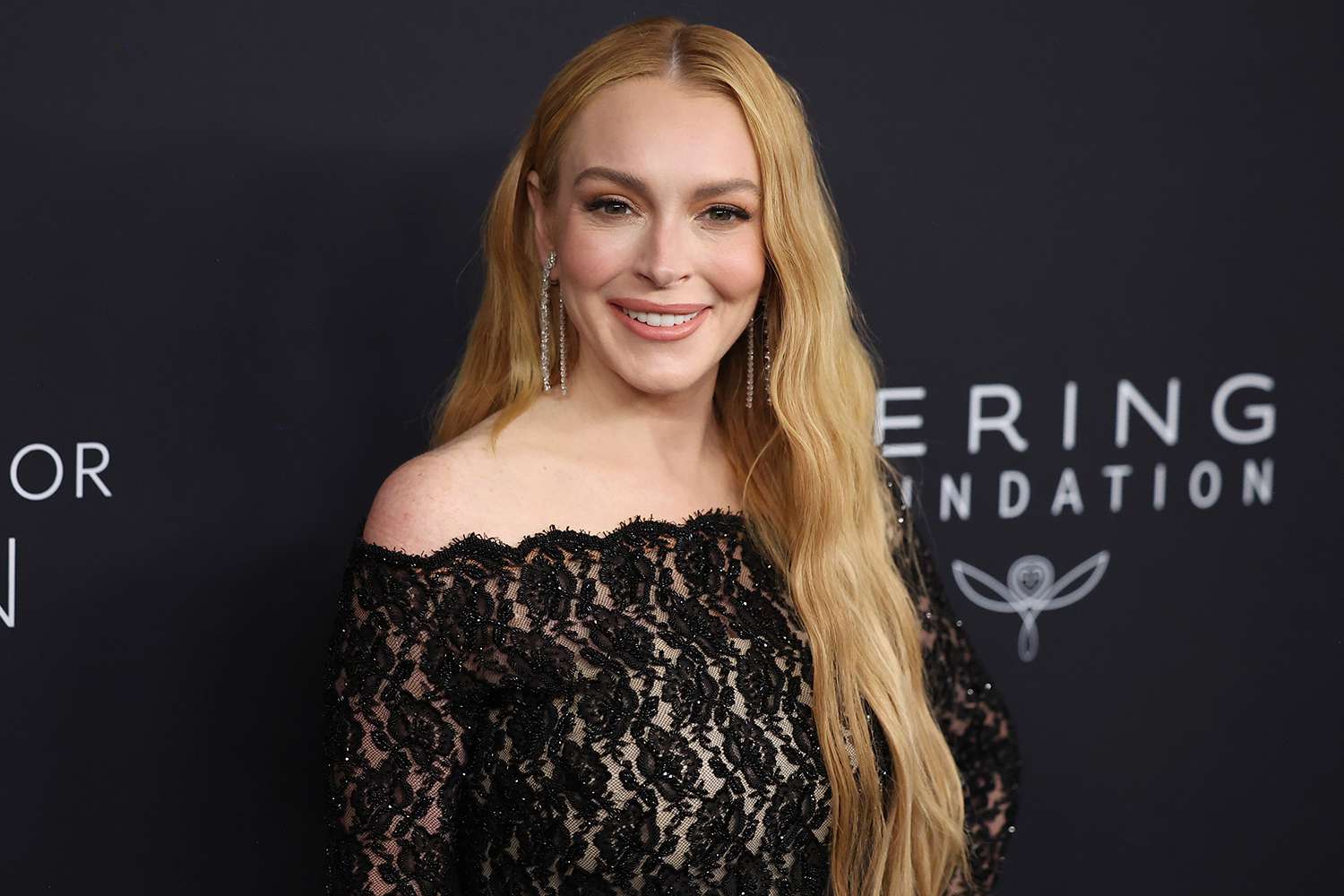 Lindsay Lohan Dons Sheer Lace Bodysuit at Kering Foundation Caring for Women Event