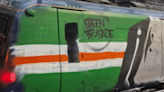 Green Brigade cover train in Celtic-themed spray paint at Glasgow Central