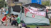 After spending night in open air, Kepung Demi Palestin picketers back in tents as DBKL officers look on