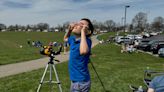 Viewers in awe as they watch the moon and the sun on Monday afternoon in Ashland