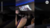 Watch: Airline passenger gets comfortable, uses projector to screen 'The Patriot' on flight