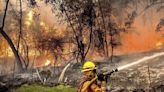 California fire scorches through land the size of Los Angeles as blazes burn across US West