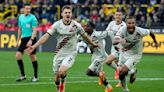Stanišić scores late at Dortmund to keep Leverkusen's record 45-game unbeaten run going