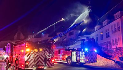 Firefighters douse a blaze at a historic Oregon hotel famously featured in 'The Shining'