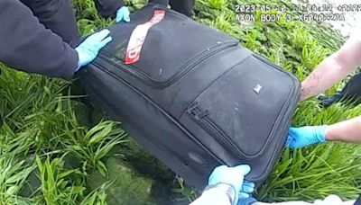 Murderer father filmed carrying child while dragging suitcase containing wife’s body