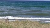 A `gustnado’ churns across a Michigan lake. Experts say these small whirlwinds rarely cause damage