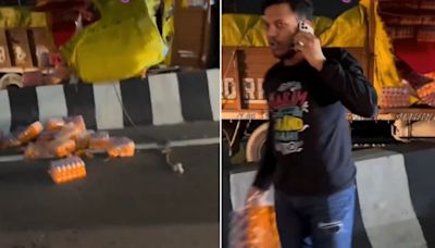 Pathetic! Man With i-Phone And Karma Tshirt Steals Soft Drinks After Consignment Truck Meets With An Accident...