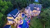 This $3.4M lakeside SC home has its own water park resort in its back yard. Take a look