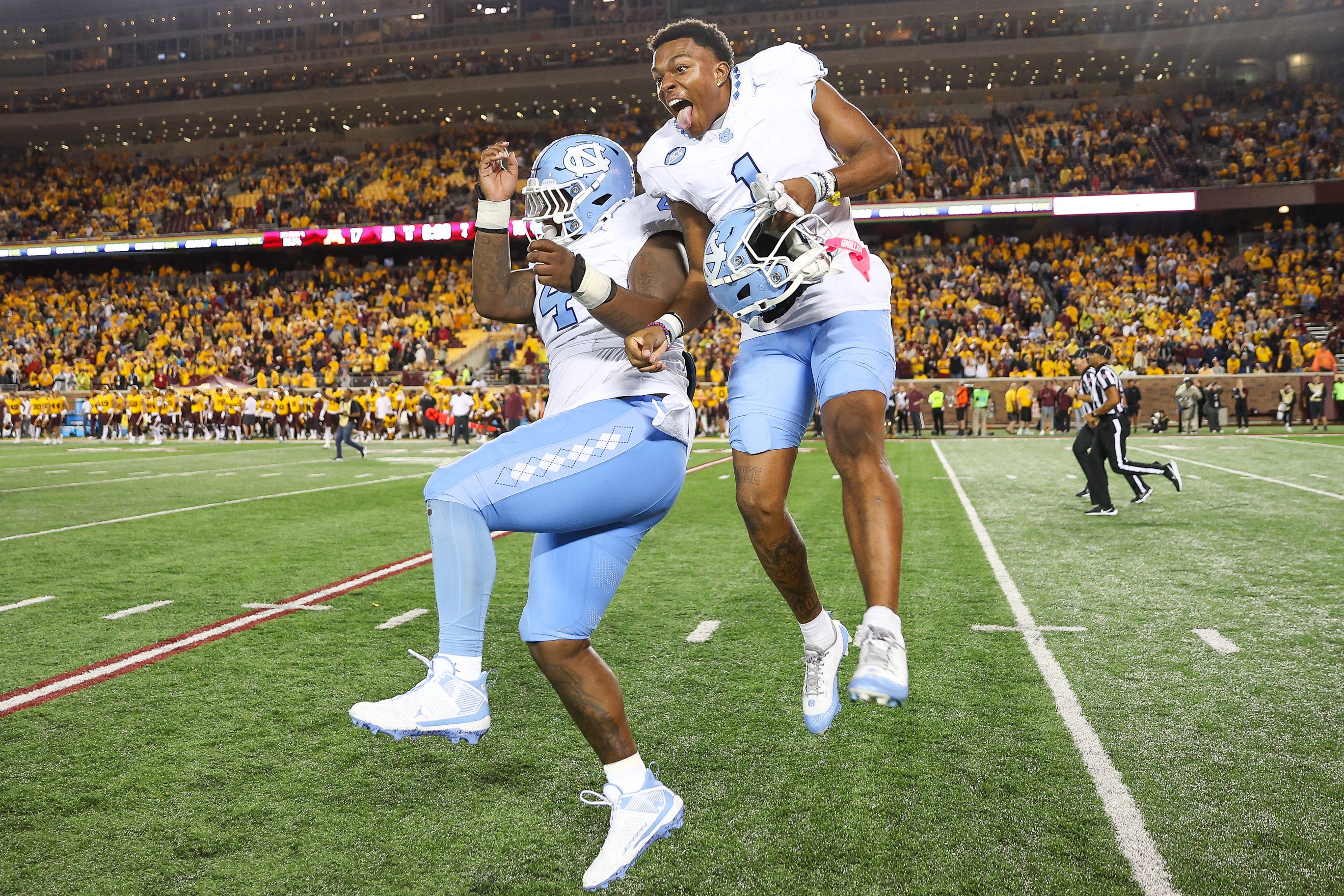 Charlotte head football coach Biff Poggi praises UNC program