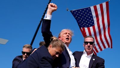 Donald Trump is escorted from stage after shots fired during Pennsylvania rally