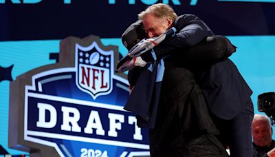 Titans draft pick JC Latham gives Roger Goodell bear hug on draft stage despite commish's recent back surgery